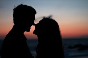 Couples facing each other outdoors having a conversation with a positive attitude.