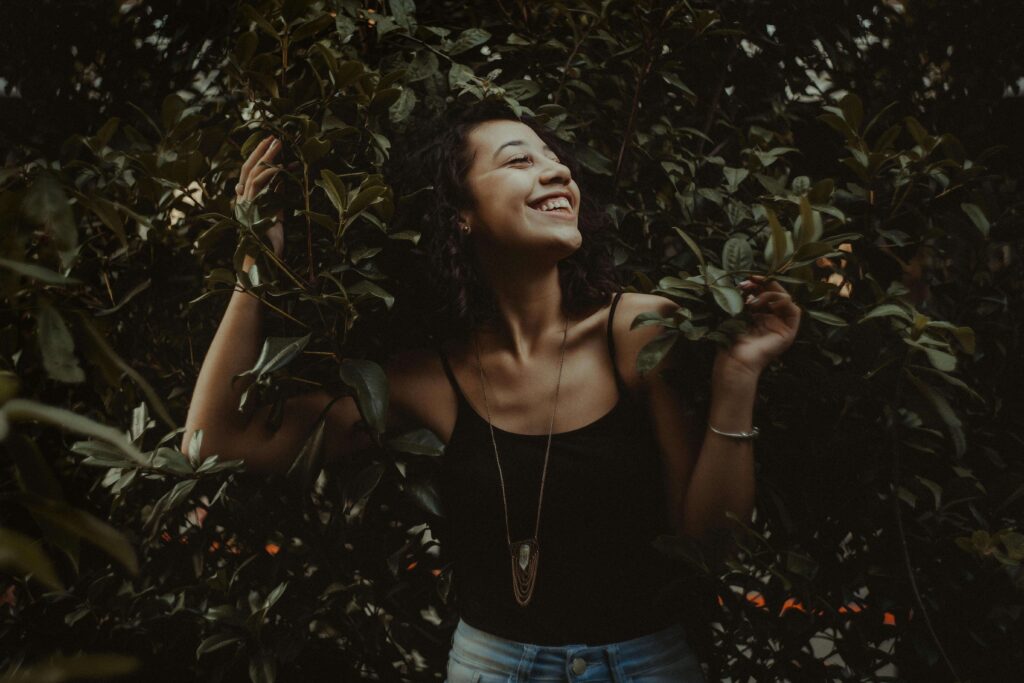 person enjoying life as they smile in nature due to no longer being controlled by anxiety