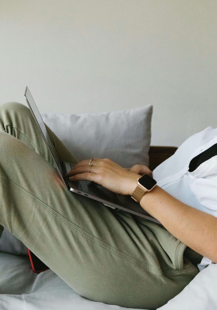 person sitting comfortably on a couch getting ready for online therapy in Oklahoma