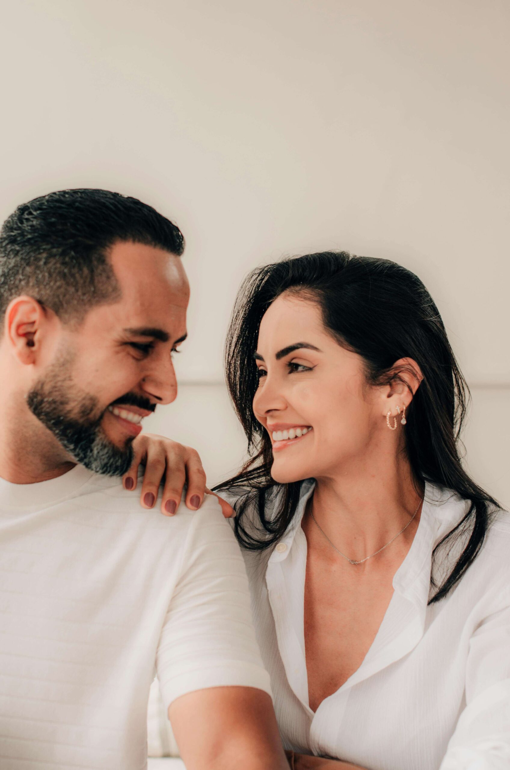 Couple looking at each other and smiling after working through issues in counseling