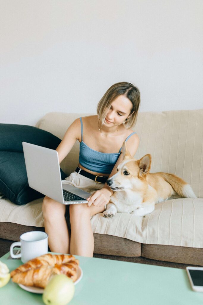 Online therapist speaking during a virtual counseling session in Colorado with a welcoming background and cute dog.