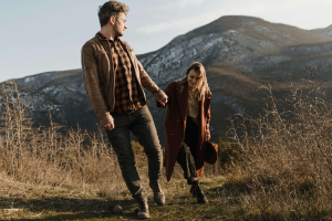 Couple holding hands outside noticing connection after marriage therapy in colorado