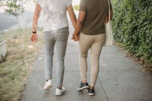 Couple holding hands after a counseling session reflecting marriage therapy in Colorado support