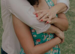 Couple hugging as they practice a connection ritual learned through marriage counseling in OKC.