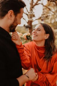 Spouse caressing their partner's face after learning communication skills in couples intensive near me