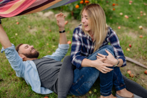 A couple spending time together outside after taking the time to connect after what they learned from couples counseling in Edmond